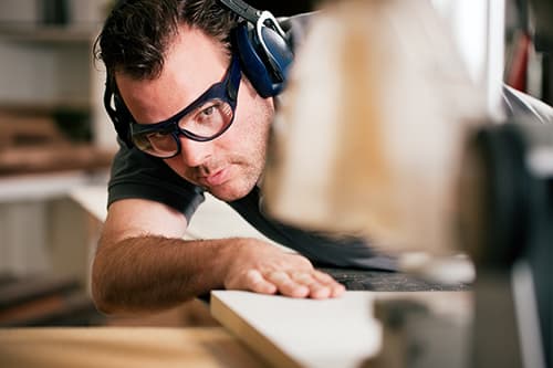 Carpenter wearing safety goggles