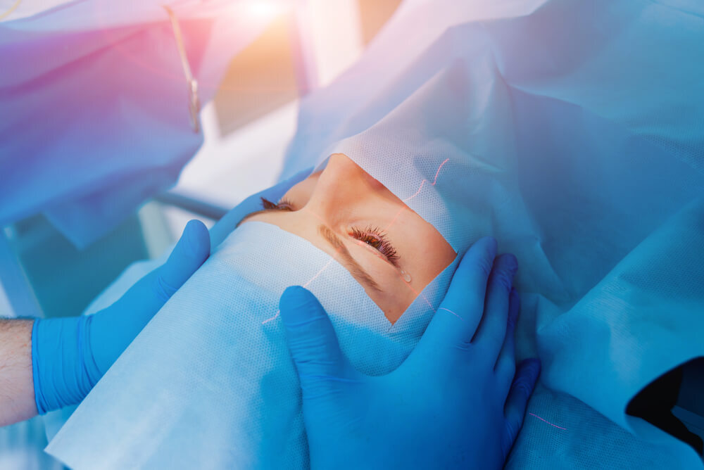 Woman's eyes under surgical paper