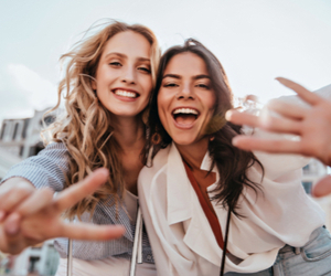 two girls taking selfie 