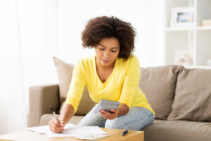 woman using calculator