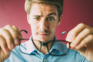 man checking on glasses subscription