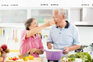 married couple sharing food 